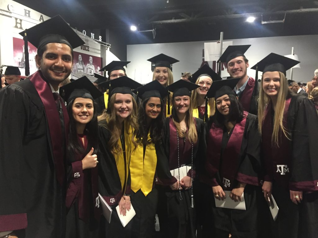 group of students wearing graduation robes and caps