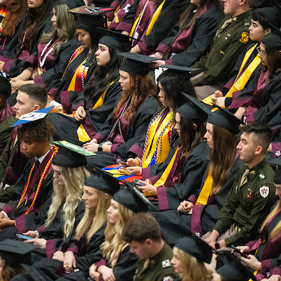 students seated at graduation