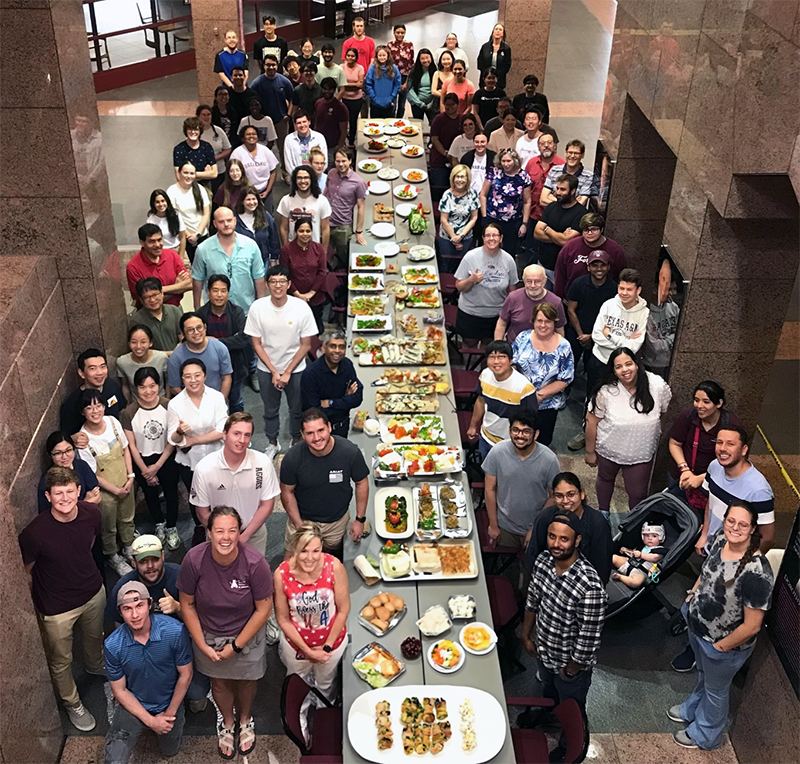BCBP department members posing at a department potluck event